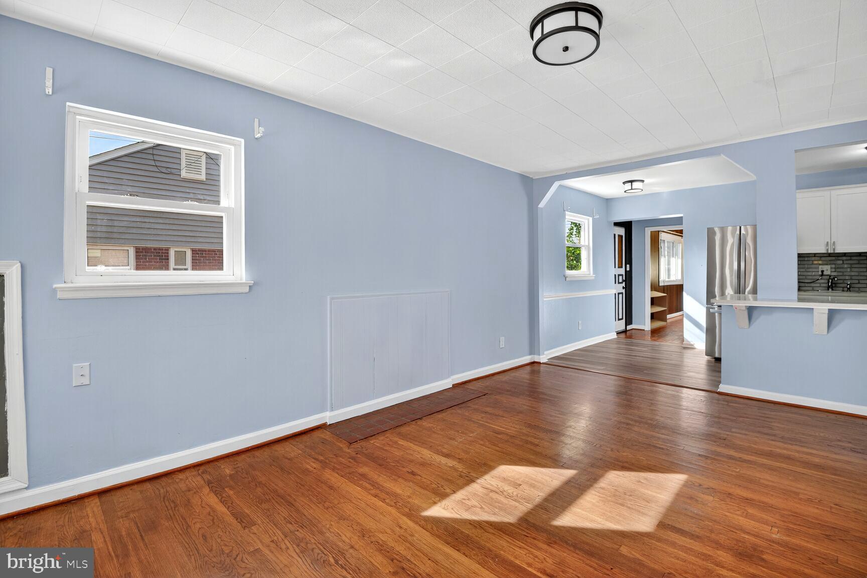 8204 17th Avenue Hyattsville, MD 20783 - Photo 9 of 36 a view of a livingroom with wooden floor