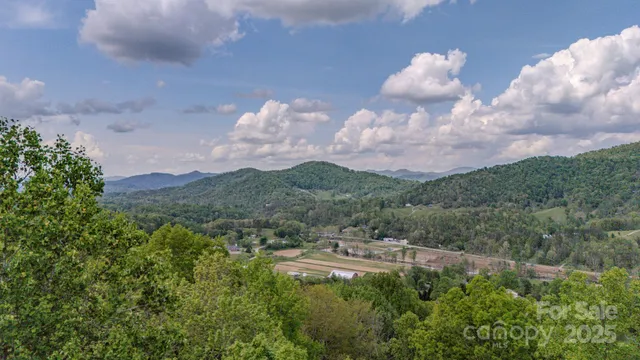 a aerial view of a house with a yard