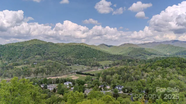 a view of a town with mountains in the background
