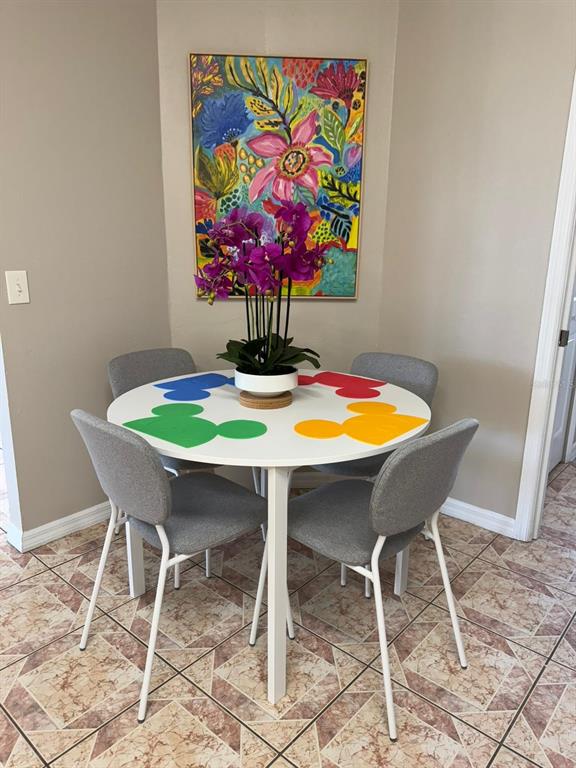 2526 Jasmine Trace Drive Kissimmee, FL 34758 - Photo 11 of 31 a view of a dining room with furniture and wooden floor