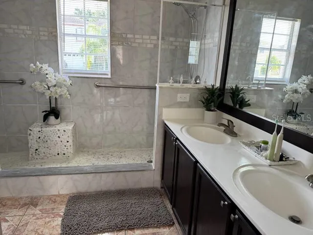 a bathroom with a sink and a mirror