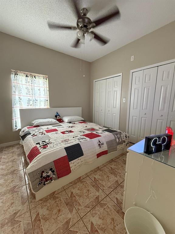2526 Jasmine Trace Drive Kissimmee, FL 34758 - Photo 20 of 31 a bedroom with bed and a window