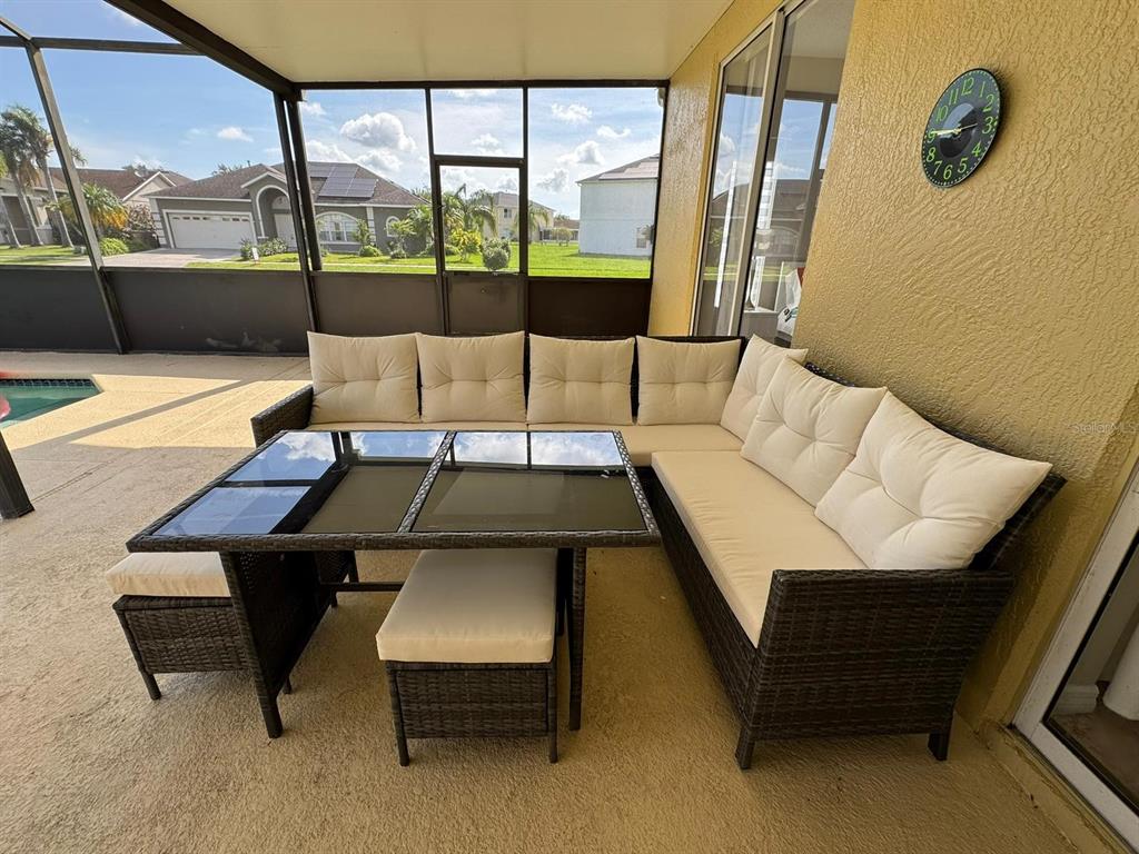 2526 Jasmine Trace Drive Kissimmee, FL 34758 - Photo 28 of 31 a living room with a couch and large window