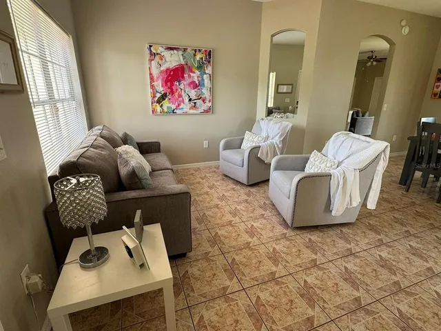 a living room with furniture and a window