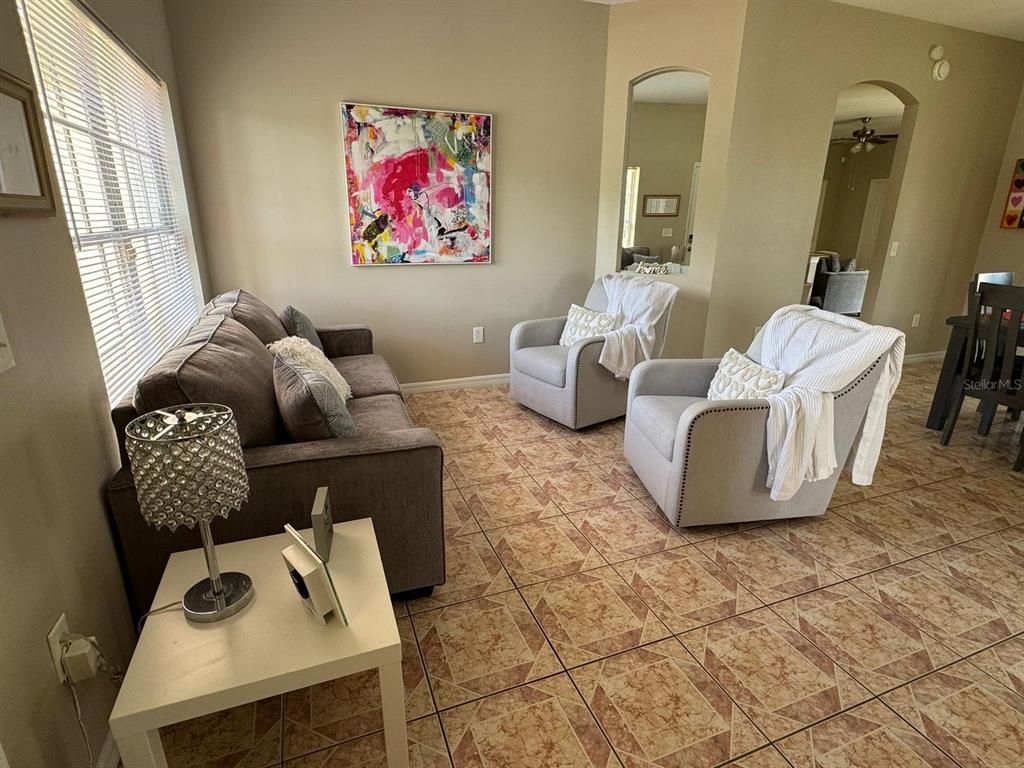 2526 Jasmine Trace Drive Kissimmee, FL 34758 - Photo 3 of 31 a living room with furniture and a window