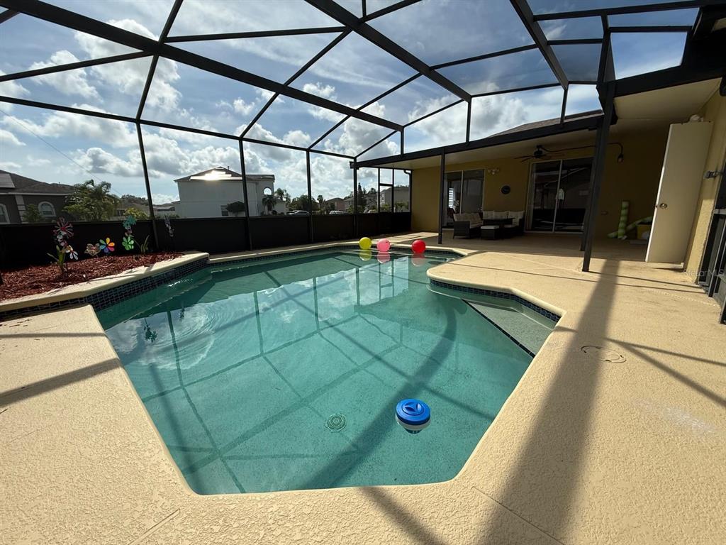 2526 Jasmine Trace Drive Kissimmee, FL 34758 - Photo 31 of 31 a view of a swimming pool with a couch