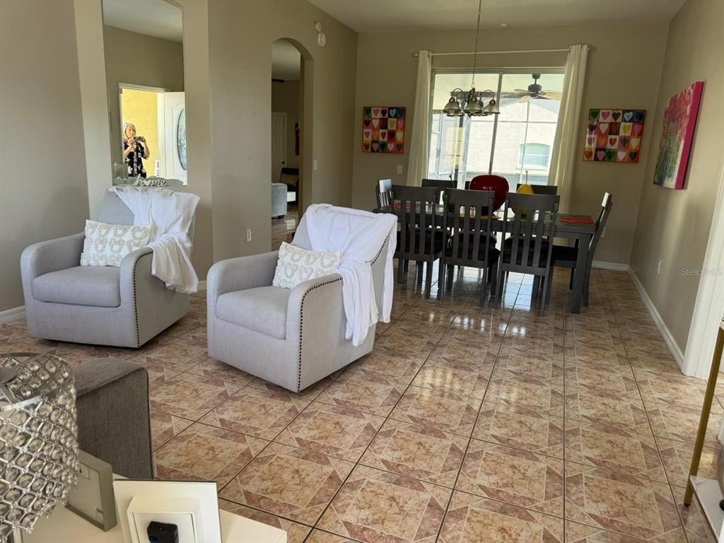 2526 Jasmine Trace Drive Kissimmee, FL 34758 - Photo 5 of 31 a living room with furniture and a large window