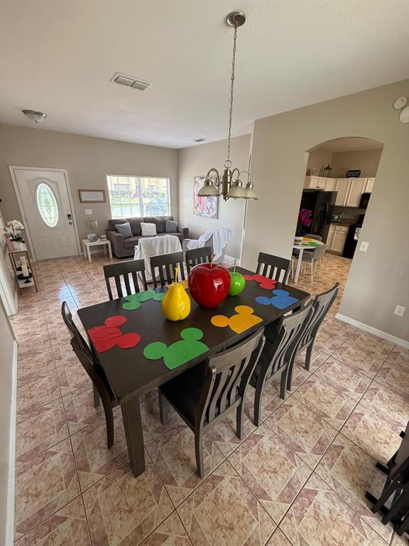2526 Jasmine Trace Drive Kissimmee, FL 34758 - Photo 8 of 31 a view of a dining room with furniture