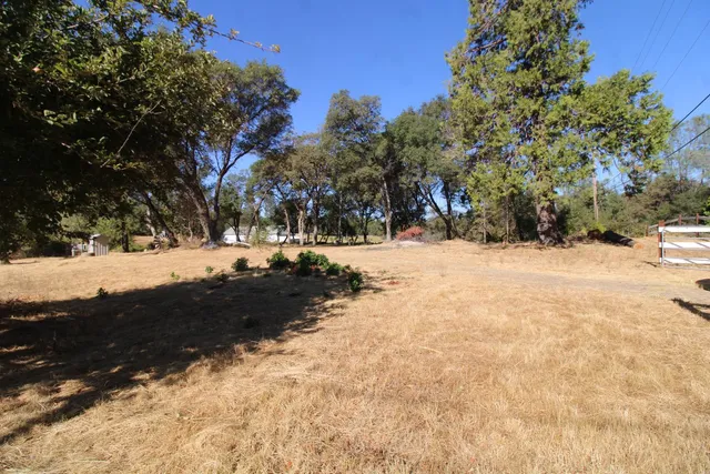 aerial view of a house with a yard