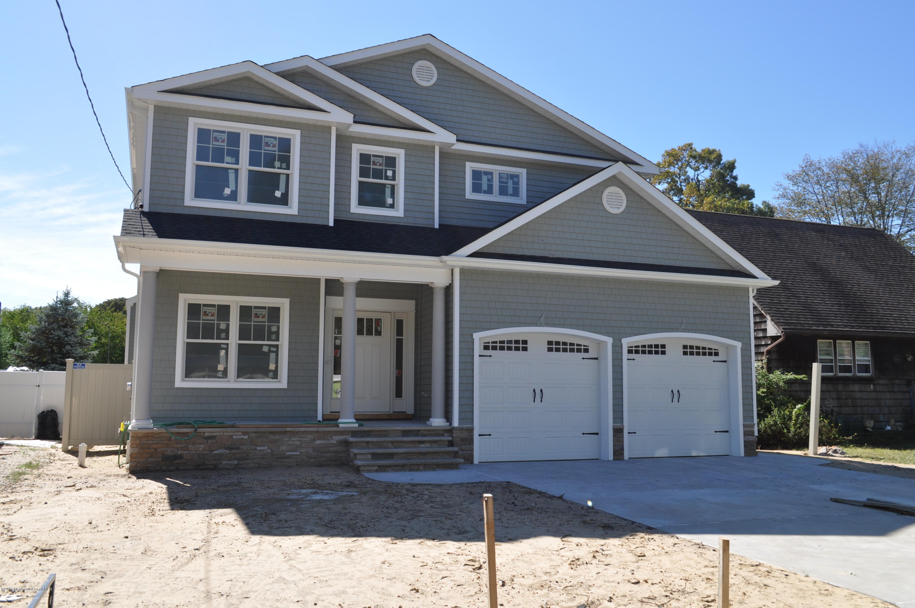 2210 N Road Point Pleasant, NJ 08742 - Photo 1 of 5 a front view of a house with a yard