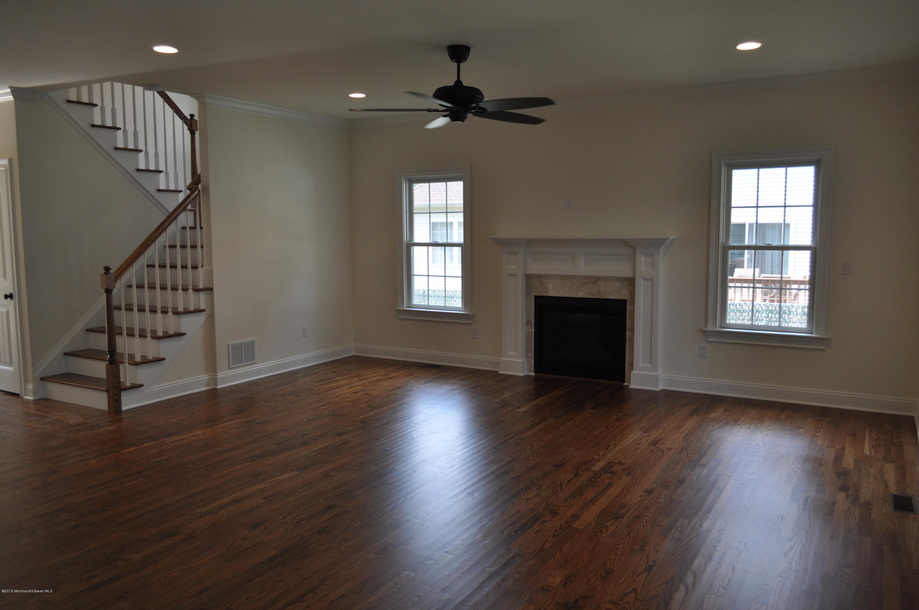2210 N Road Point Pleasant, NJ 08742 - Photo 3 of 5 a view of an empty room with wooden floor fireplace and a window