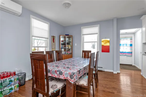a view of a dining room with furniture and window