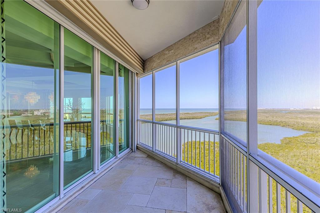 295 Grande Way, Unit PH2 Naples, FL 34110 - Photo 29 of 45 a view of two chairs in the balcony