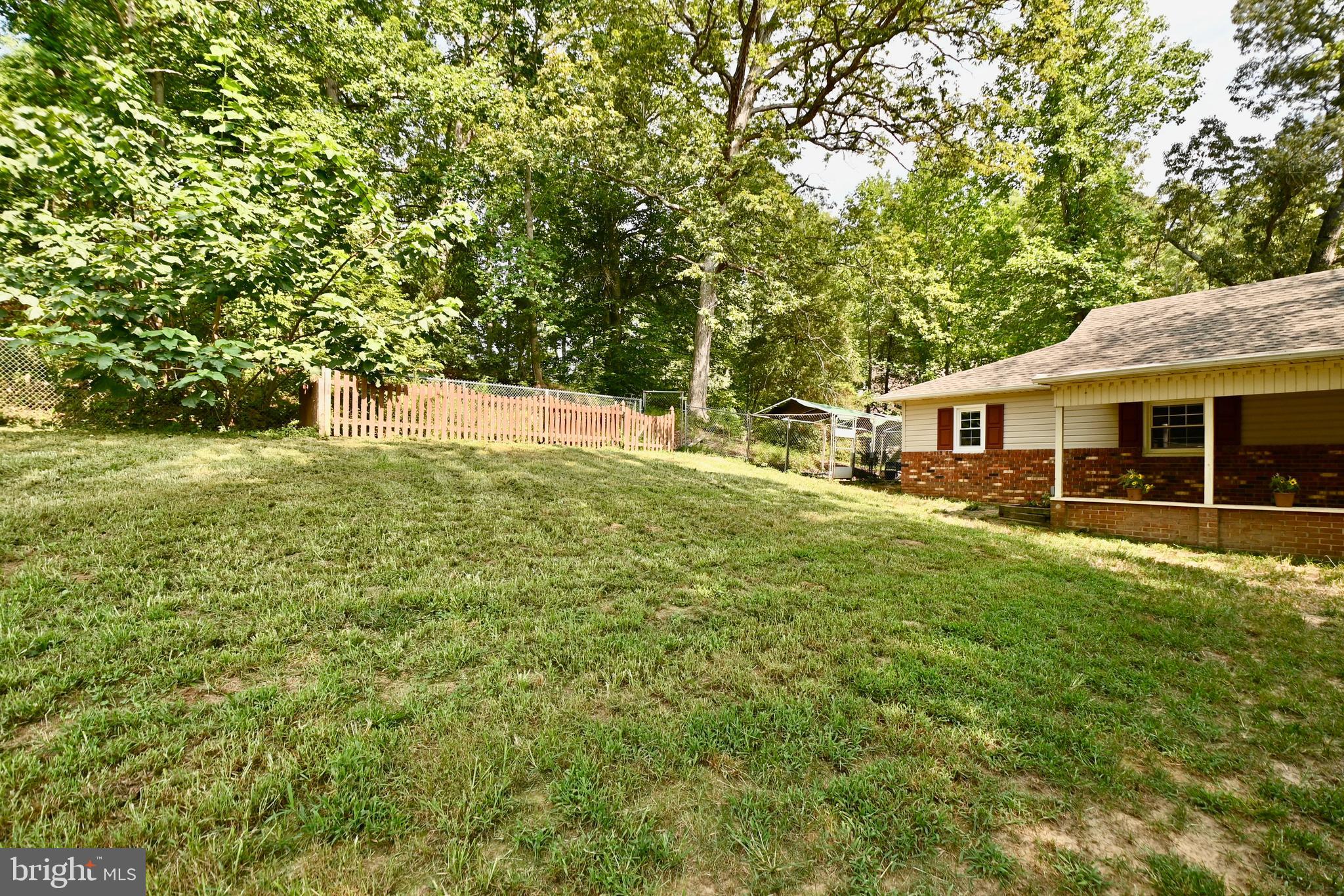 262 Decatur Road Stafford, VA 22554 - Photo 2 of 29 FRONT YARD SHOWING ENCLOSED DOG RUN AND GARDEN