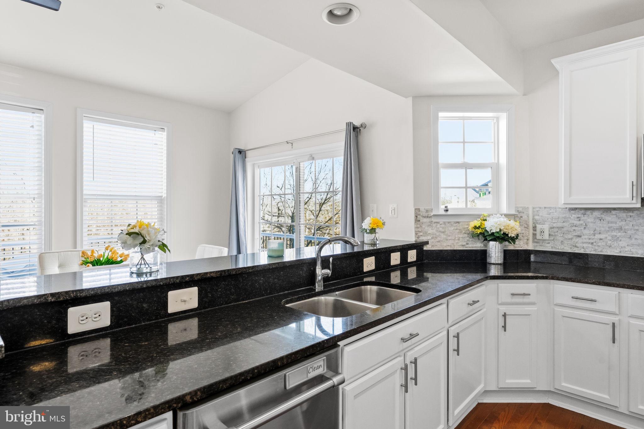 11904 Parallel Road Bowie, MD 20720 - Photo 25 of 86 a kitchen with granite countertop a sink and a window