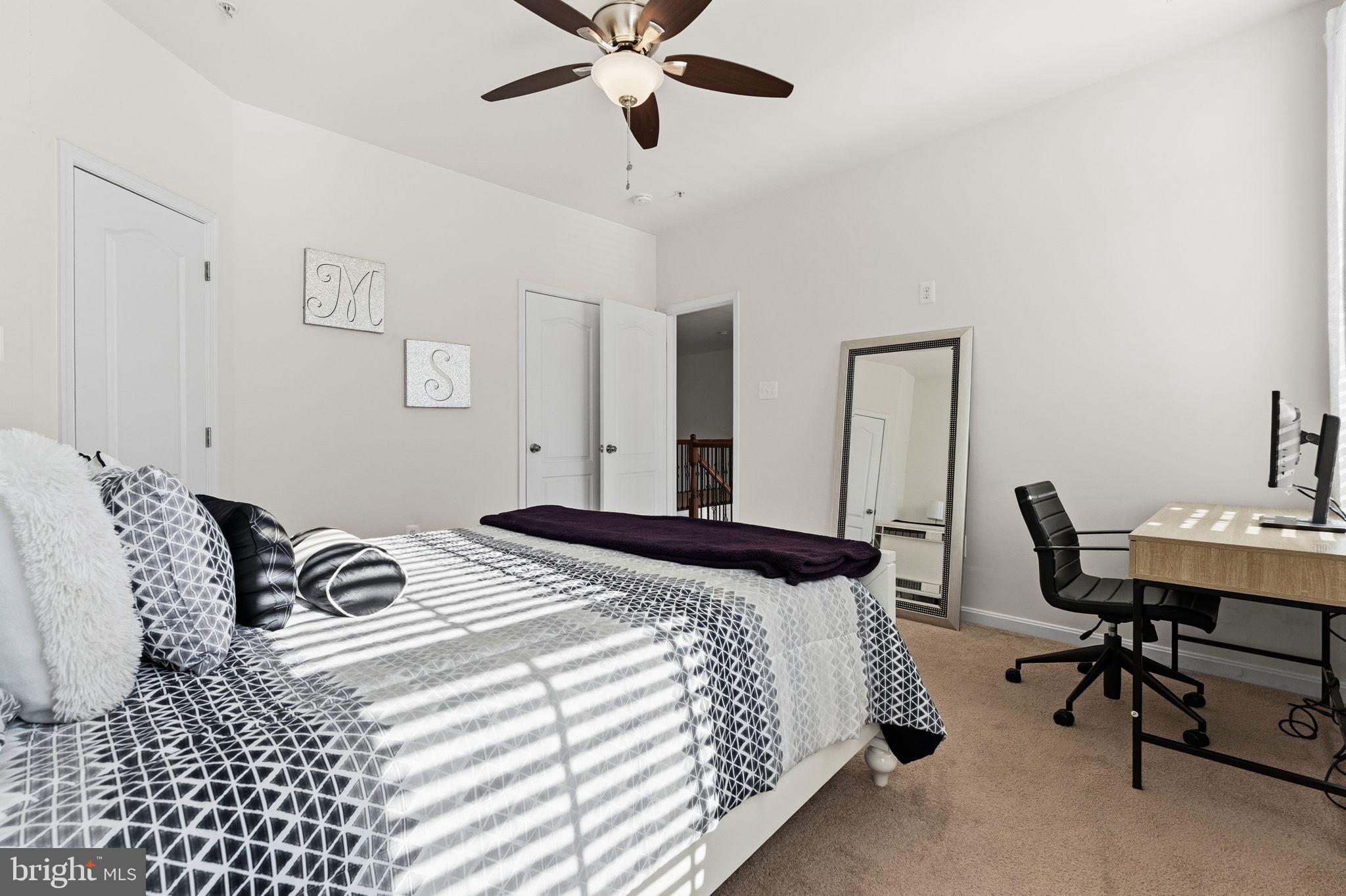 11904 Parallel Road Bowie, MD 20720 - Photo 46 of 86 a bedroom with a bed a desk and chair