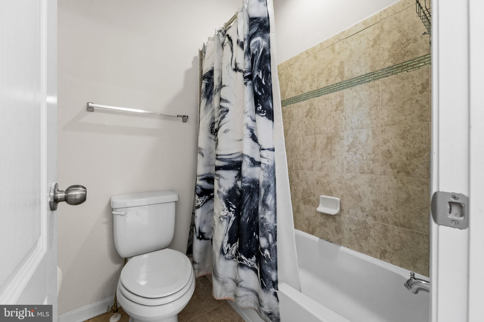 11904 Parallel Road Bowie, MD 20720 - Photo 48 of 86 a bathroom with a toilet and a shower