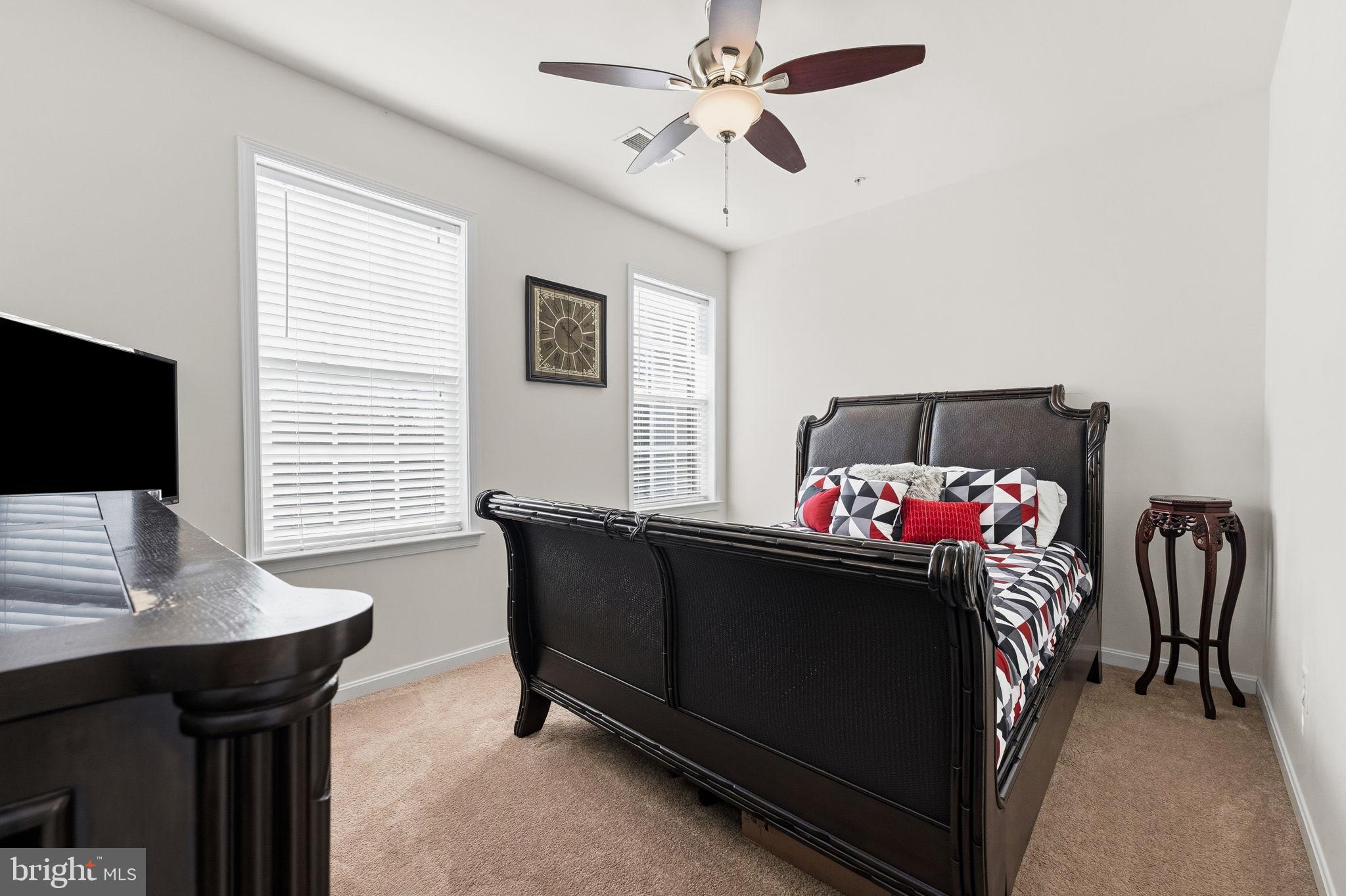 11904 Parallel Road Bowie, MD 20720 - Photo 51 of 86 a bedroom with a bed and a flat screen tv