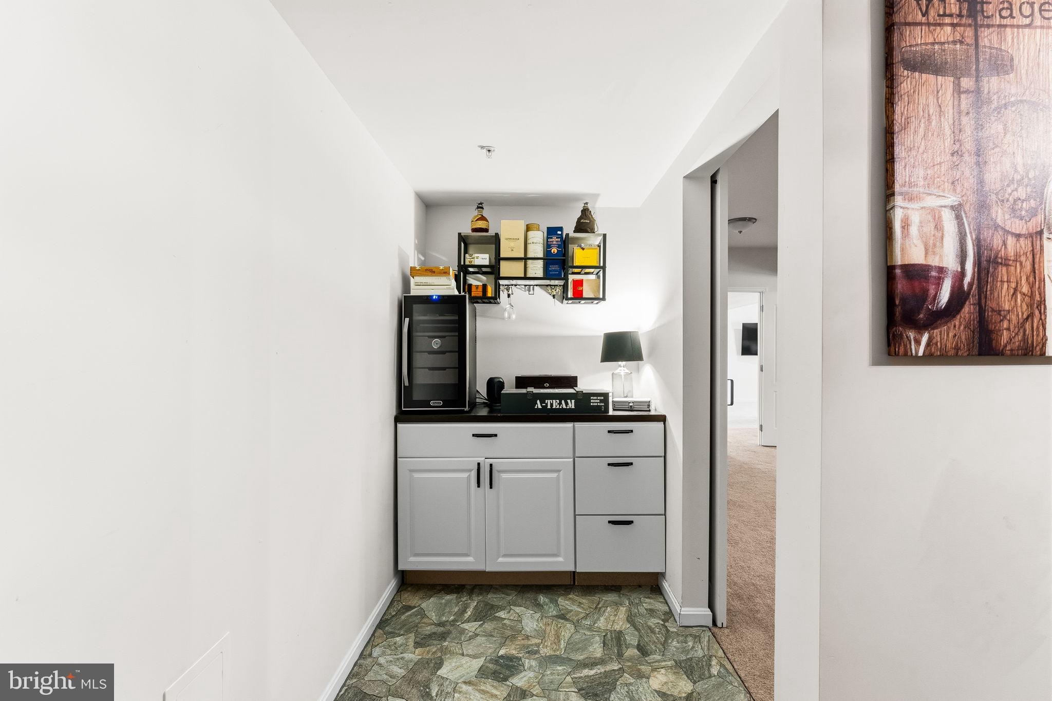 11904 Parallel Road Bowie, MD 20720 - Photo 63 of 86 a kitchen with granite countertop a sink and a stove