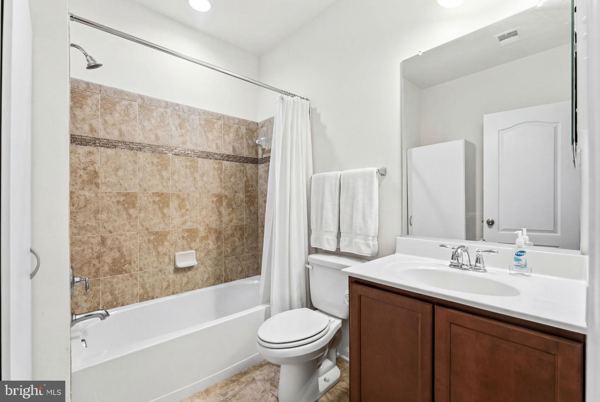 11904 Parallel Road Bowie, MD 20720 - Photo 66 of 86 a bathroom with a sink and a mirror