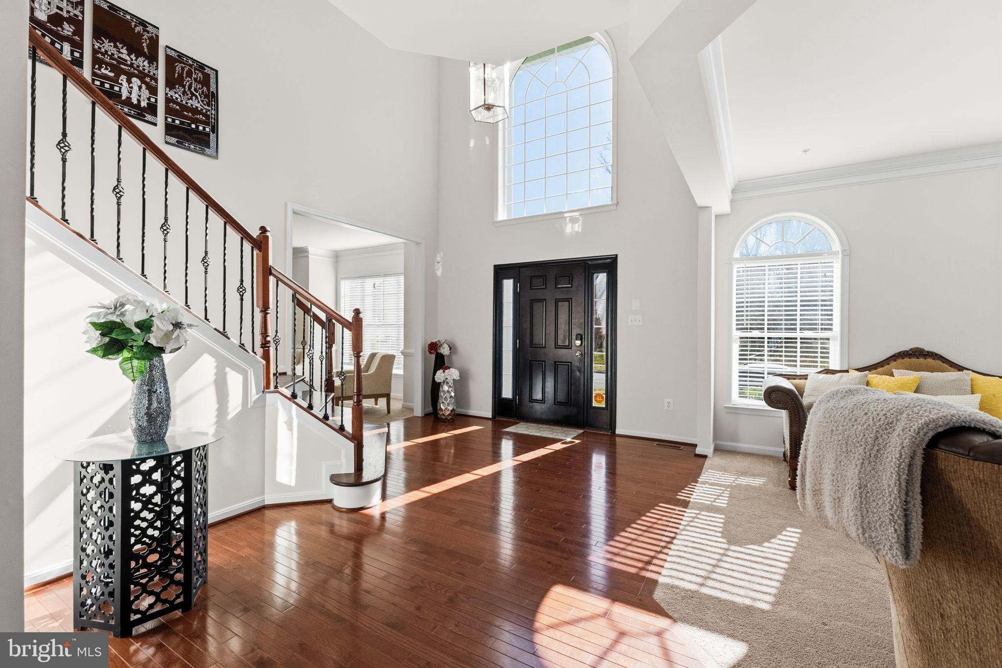 11904 Parallel Road Bowie, MD 20720 - Photo 7 of 86 a view of entryway and hall with wooden floor
