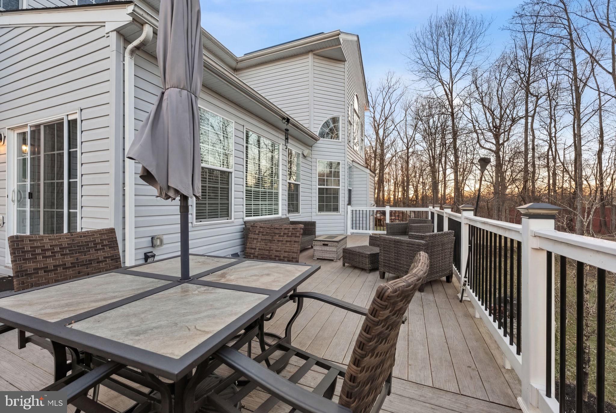 11904 Parallel Road Bowie, MD 20720 - Photo 71 of 86 a view of a patio with a table and chairs