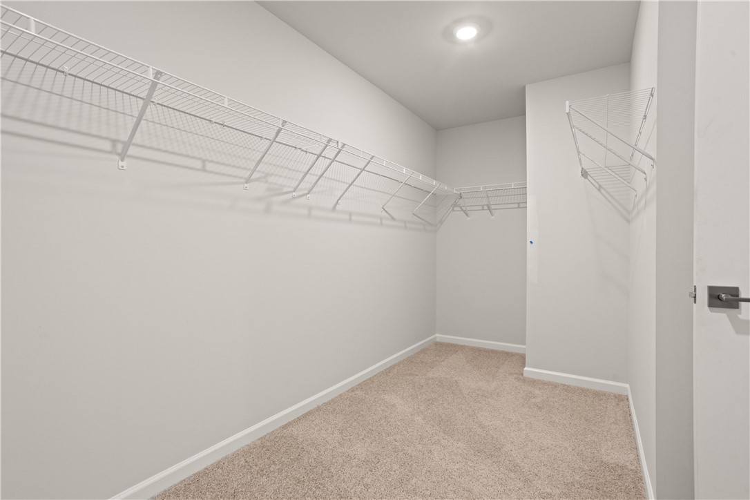 631 Sweetspire Trail, Unit 148 Seneca, SC 29678 - Photo 30 of 36 Ample wire shelving provides practical storage in this well-lit walk-in closet.