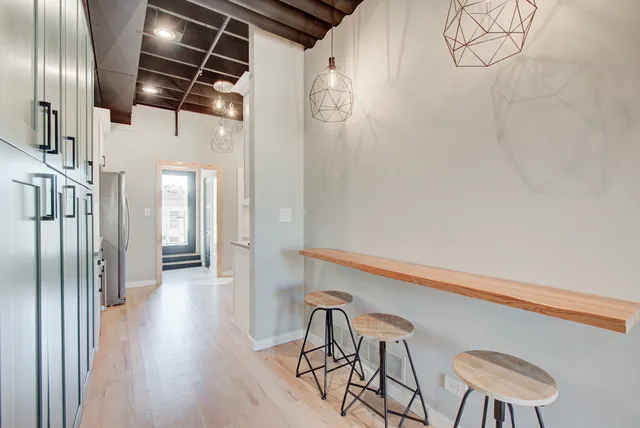 a kitchen with stainless steel appliances a sink a stove and refrigerator