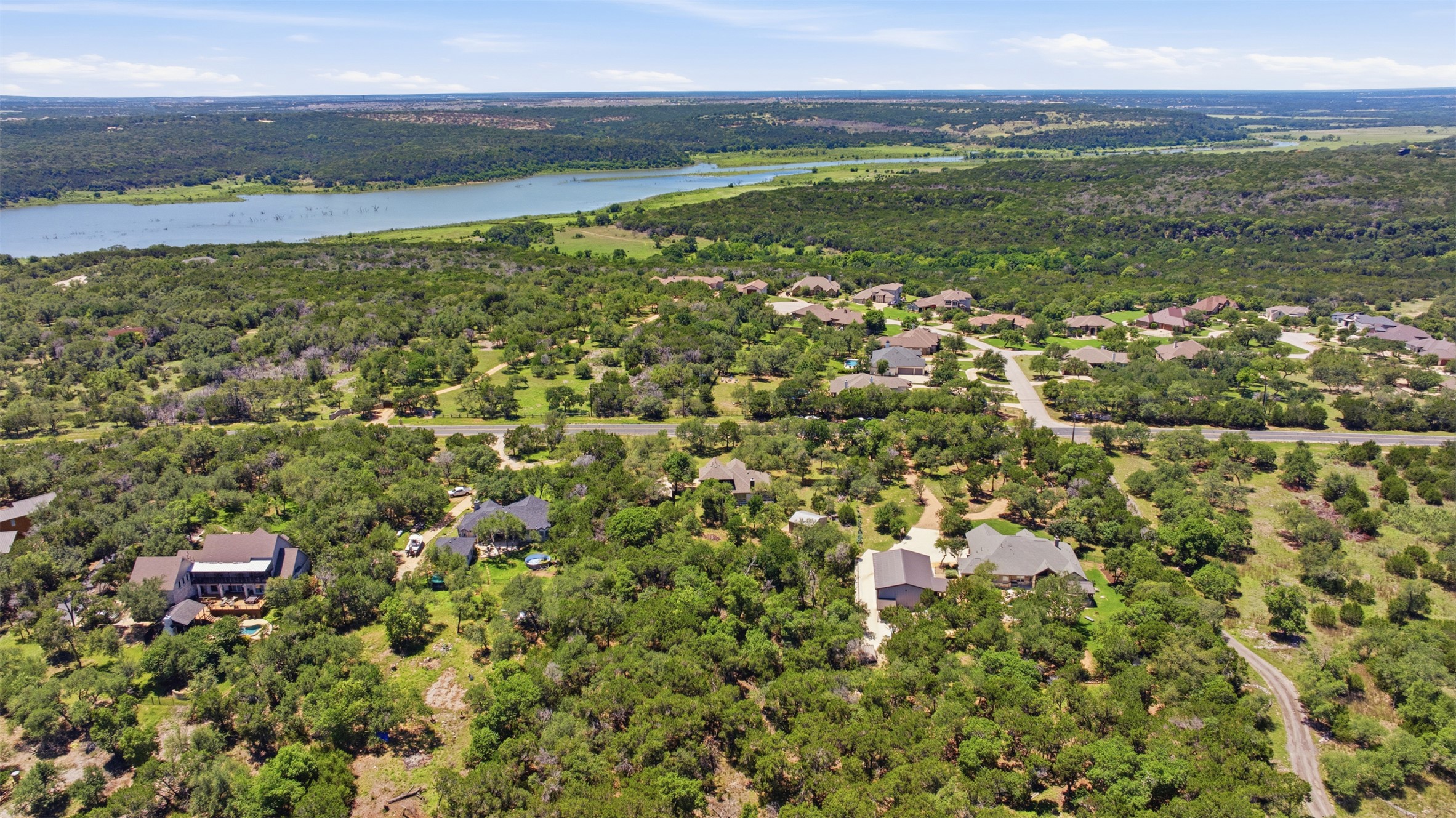 1301 County Road 262 Georgetown, TX 78633 - Photo 5 of 39 Expansive aerial showcasing a residential area amidst abundant tree coverage