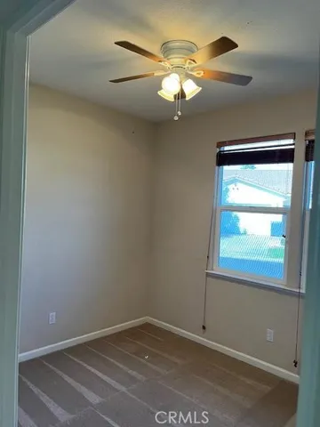 a view of an empty room with a window