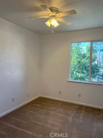 a view of a room that has a window in it