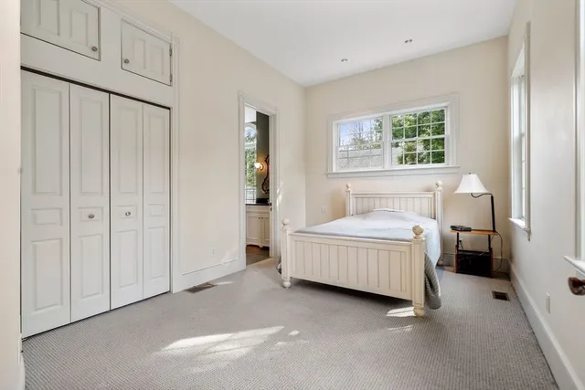 a room with a bed and a window