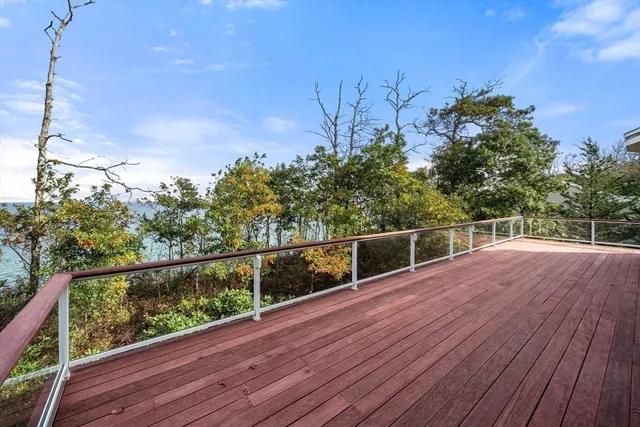 a view of a balcony with wooden fence