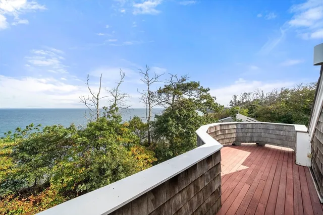 a view of balcony with wooden floor and outdoor space