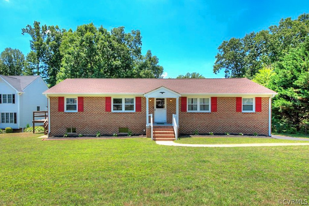 5126 Hackney Road North Chesterfield, VA 23234 - Photo 45 of 45 a front view of a house with a yard and garage