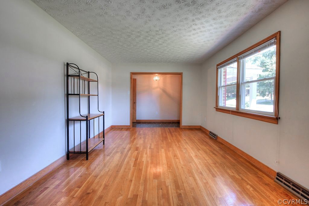 5126 Hackney Road North Chesterfield, VA 23234 - Photo 8 of 45 an empty room with wooden floor and windows