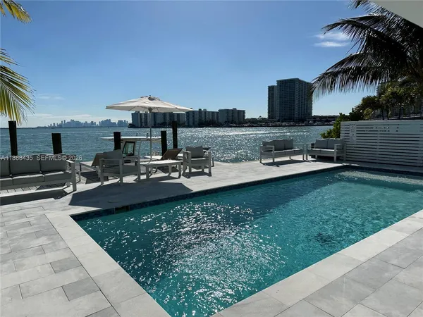a view of a swimming pool with a patio
