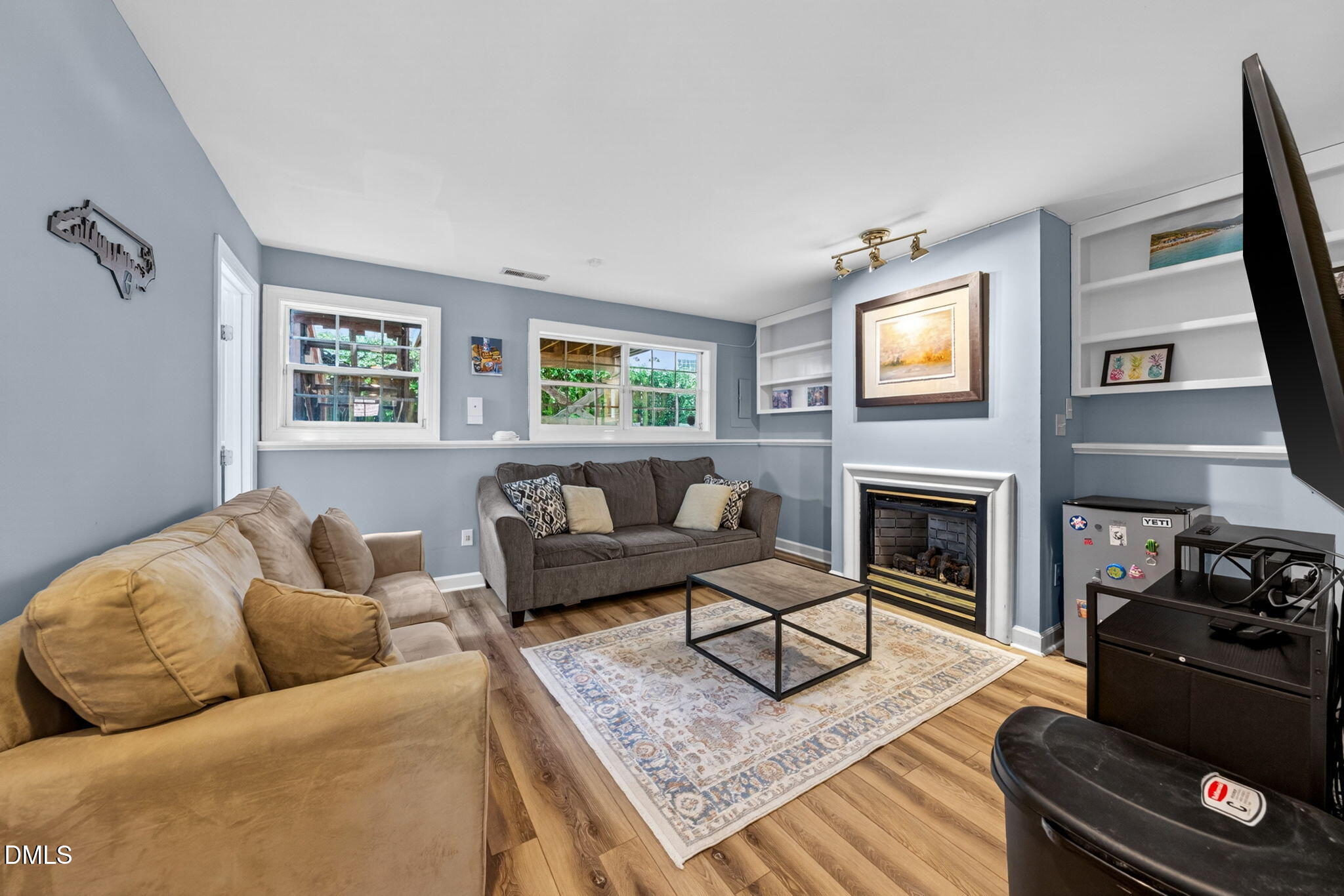 5500 Vista View Court Raleigh, NC 27612 - Photo 24 of 38 a living room with furniture and a fireplace