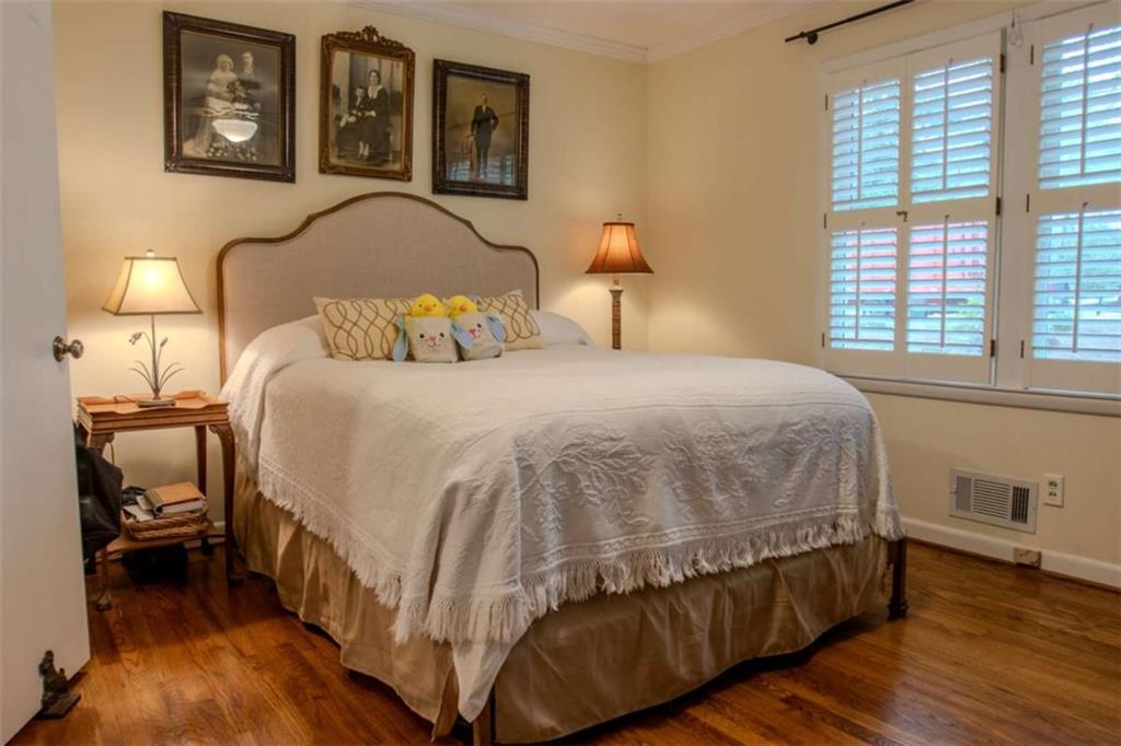 849 Bobbin Mill Road Athens, GA 30606 - Photo 13 of 32 a bedroom with a bed and wooden floor