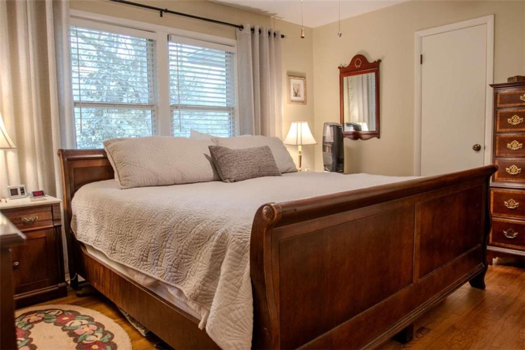 849 Bobbin Mill Road Athens, GA 30606 - Photo 16 of 32 a bedroom with a bed and large windows