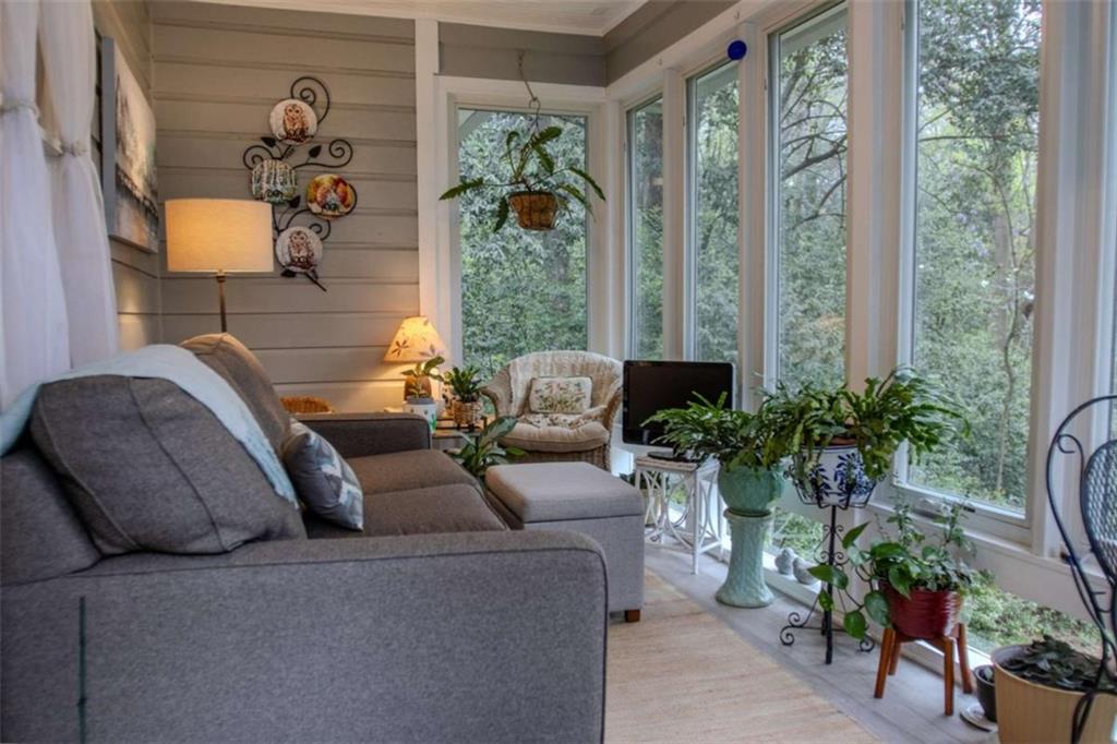 849 Bobbin Mill Road Athens, GA 30606 - Photo 19 of 32 a living room with furniture and a potted plant