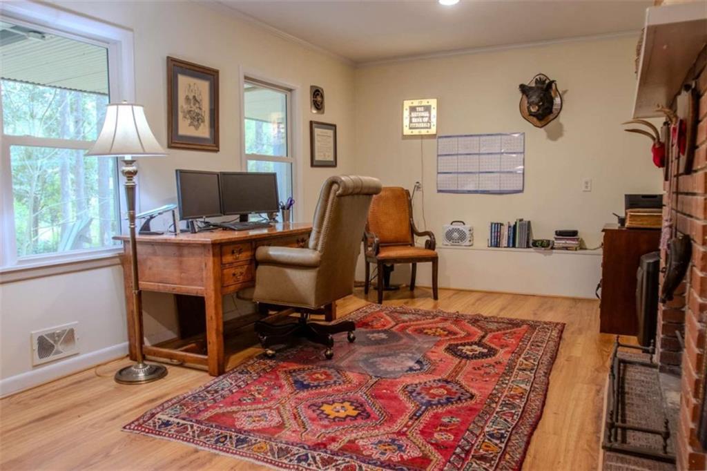849 Bobbin Mill Road Athens, GA 30606 - Photo 21 of 32 a view of a workspace with furniture and a window