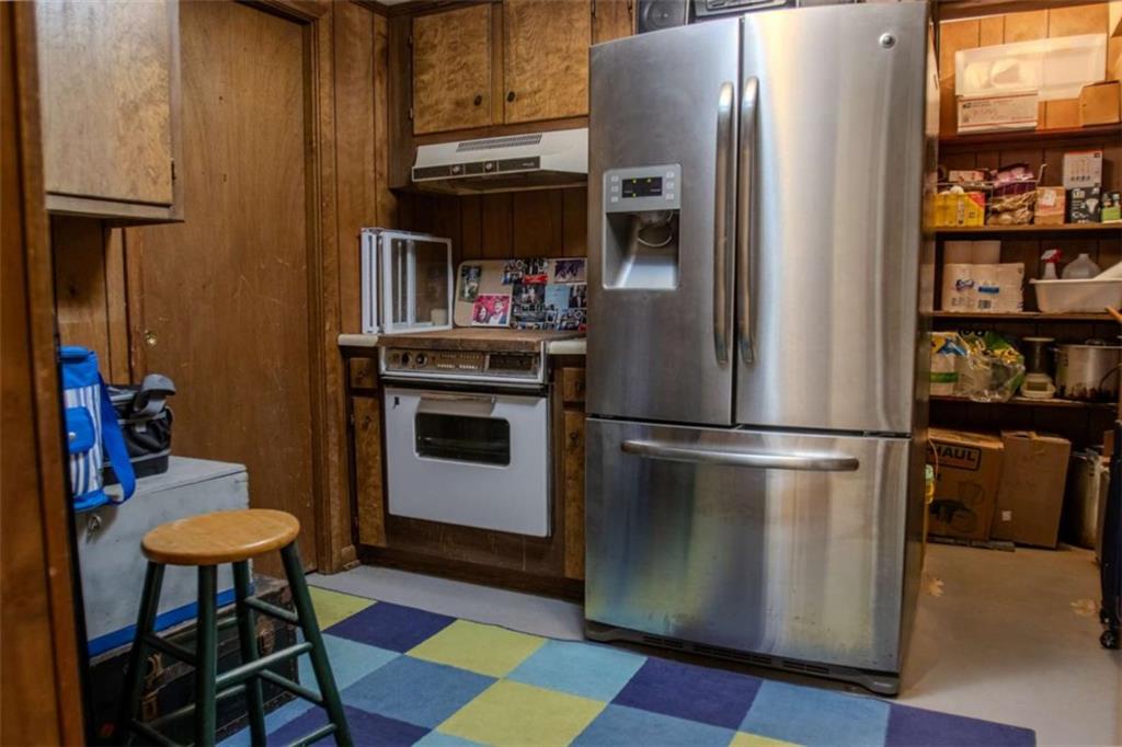 849 Bobbin Mill Road Athens, GA 30606 - Photo 24 of 32 a kitchen with stainless steel appliances a refrigerator and a stove top oven