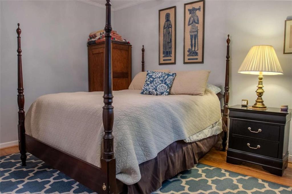 849 Bobbin Mill Road Athens, GA 30606 - Photo 25 of 32 a bedroom with bed and wooden floor