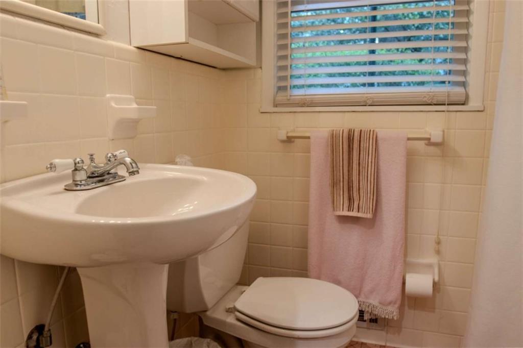 849 Bobbin Mill Road Athens, GA 30606 - Photo 27 of 32 a bathroom with a sink a toilet and shower