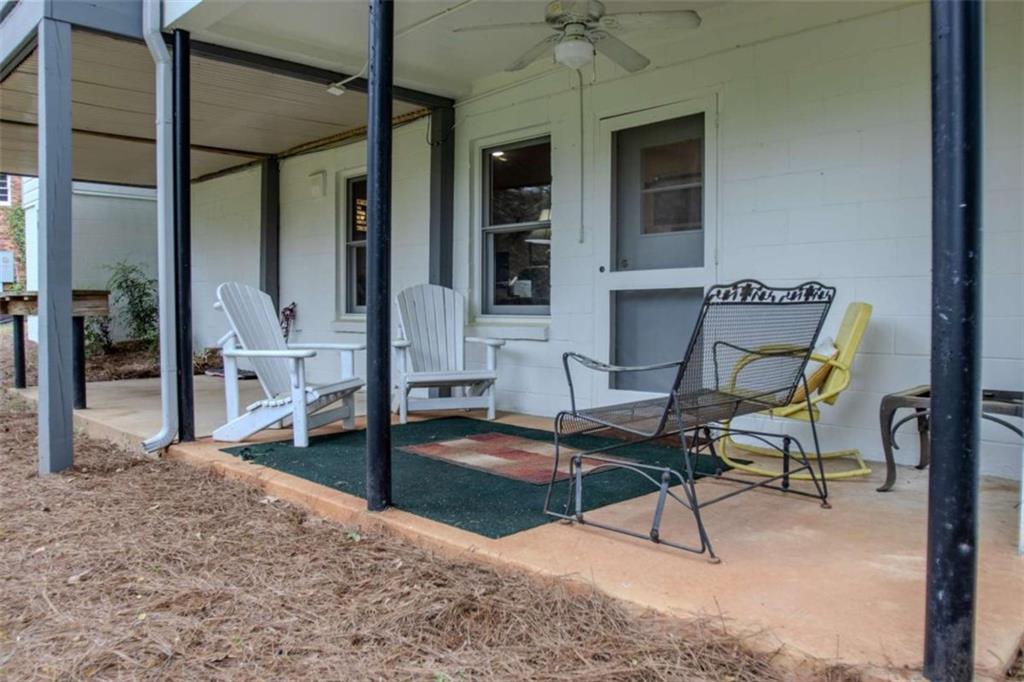 849 Bobbin Mill Road Athens, GA 30606 - Photo 28 of 32 a building outdoor space with patio furniture and potted plants