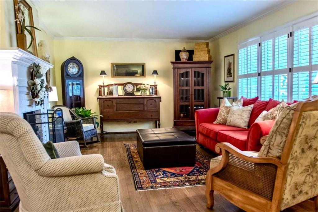 849 Bobbin Mill Road Athens, GA 30606 - Photo 6 of 32 a living room with furniture fireplace and a large window