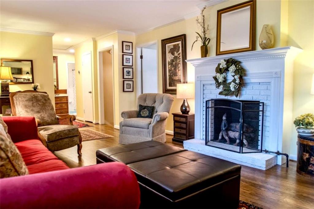 849 Bobbin Mill Road Athens, GA 30606 - Photo 7 of 32 a living room with furniture and a fireplace