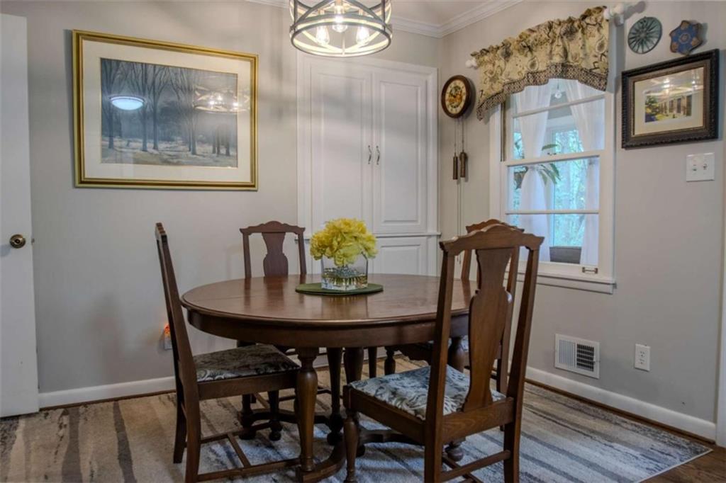 849 Bobbin Mill Road Athens, GA 30606 - Photo 8 of 32 a view of a dining room with furniture and wooden floor