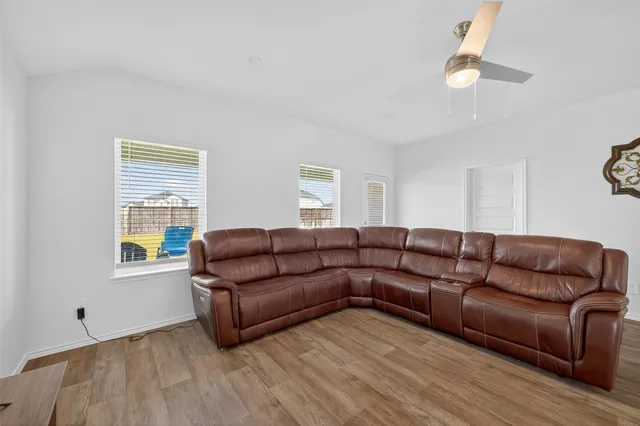 a living room with furniture and a window